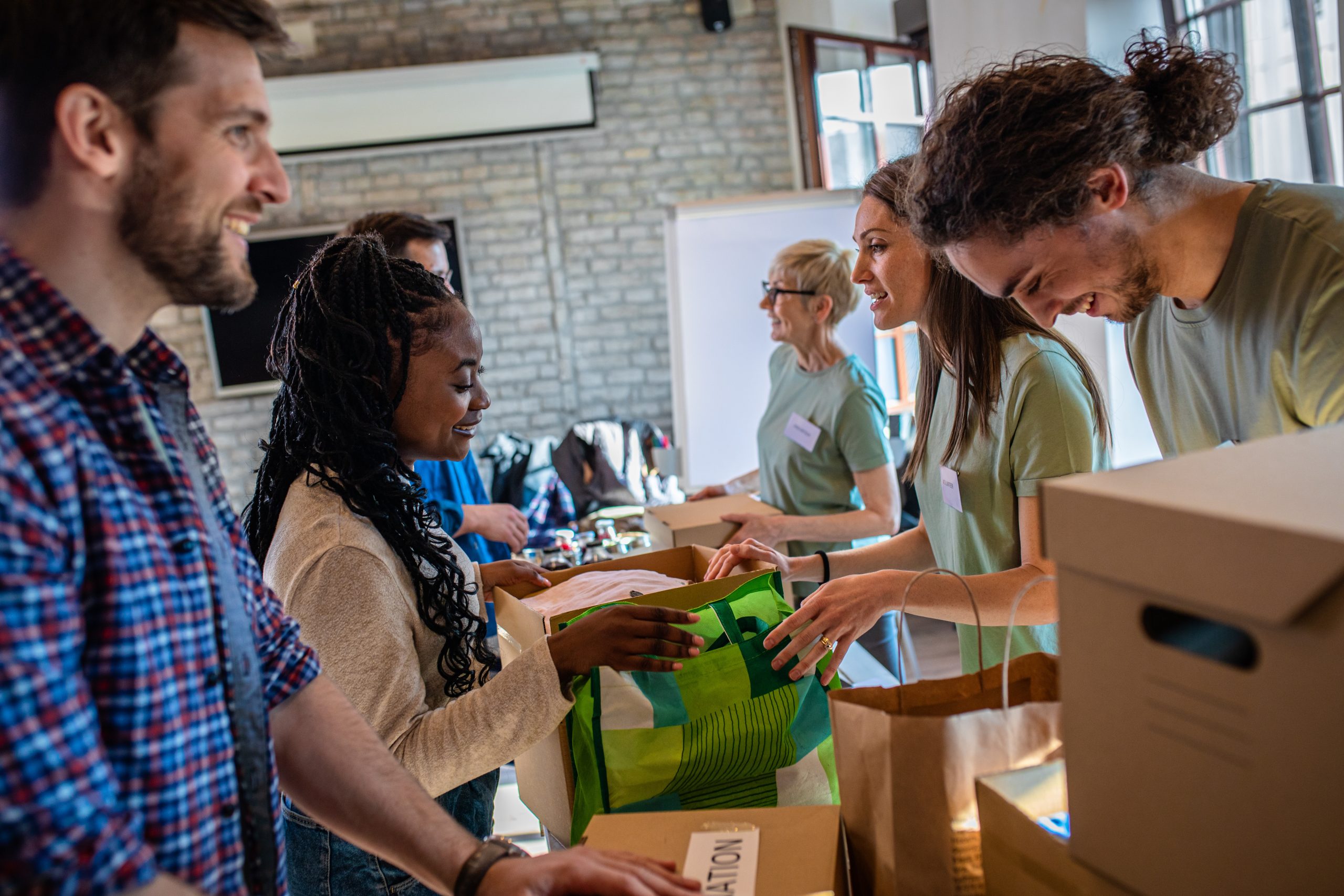 employees packing boxes for donation